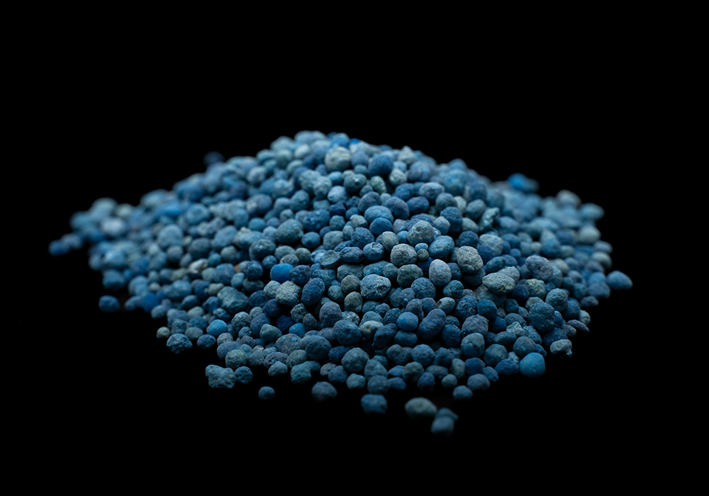 Blue NPK compound fertilizer granules in close-up